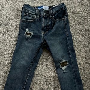 Ripped jeans with covered army print